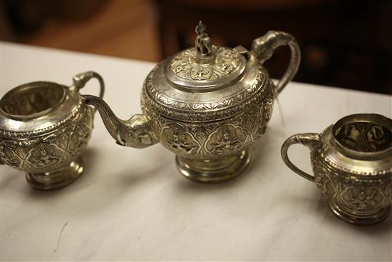 An early 20th century Indian silver three piece tea set, gross 23 oz.